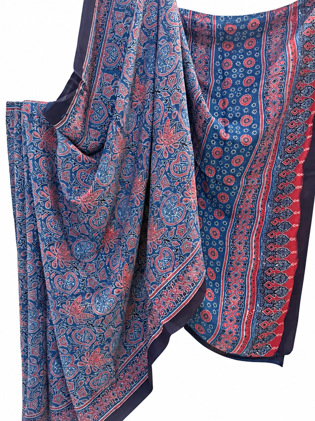 Close-up of indigo blue Ajrakh hand block print Modal silk saree featuring intricate paisley and floral motifs in red and pink with a traditional decorative border