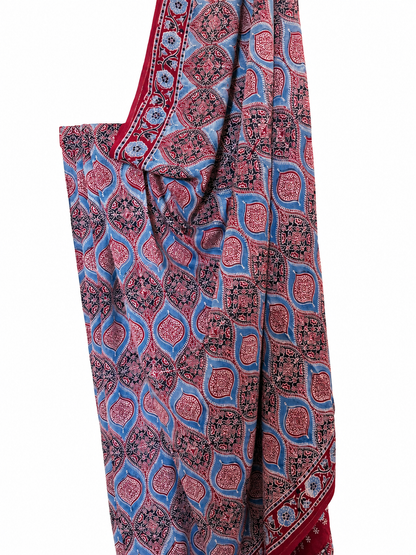 Indigo and maroon Ajrakh hand block print Modal silk saree featuring intricate paisley and floral motifs in blue, red and black with a traditional border